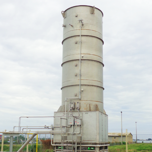 Circular Flare Tower in day with gray sky